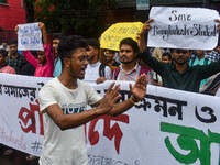 Students from Aliah University are holding posters as they are taking part in a demonstration in Kolkata, India, on July 22, 2024, demanding...