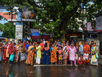 A crowd of people is waiting for transport in Kolkata, India, on July 22, 2024. (