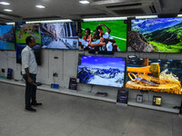 A man is operating a television at an electronic store in Kolkata, India, on July 22, 2024. The budget is boosting the ''Make in India'' cam...