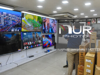 Customers are shopping at an electronic store in Kolkata, India, on July 22, 2024. The budget is boosting the ''Make in India'' campaign by...