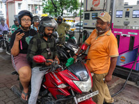 A crowd is gathering at a petrol filling station in Kolkata, India, on July 22, 2024. People are expecting some relief from the budget again...