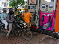 A crowd is gathering at a petrol filling station in Kolkata, India, on July 22, 2024. People are expecting some relief from the budget again...