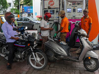 A crowd is gathering at a petrol filling station in Kolkata, India, on July 22, 2024. People are expecting some relief from the budget again...