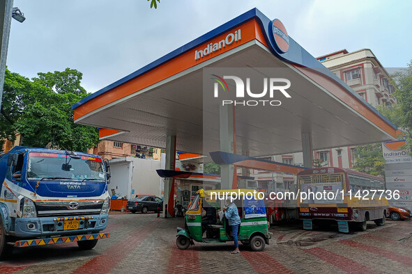 A crowd is gathering at a petrol filling station in Kolkata, India, on July 22, 2024. People are expecting some relief from the budget again...