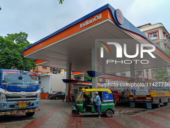 A crowd is gathering at a petrol filling station in Kolkata, India, on July 22, 2024. People are expecting some relief from the budget again...