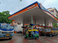 A crowd is gathering at a petrol filling station in Kolkata, India, on July 22, 2024. People are expecting some relief from the budget again...