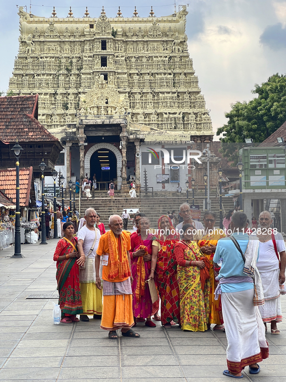 Hindu devotees are gathering outside the historic Sree Padmanabhaswamy Temple during the Panguni Utsavam (Painkuni Utsavam) festival in Thir...