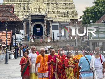 Hindu devotees are gathering outside the historic Sree Padmanabhaswamy Temple during the Panguni Utsavam (Painkuni Utsavam) festival in Thir...