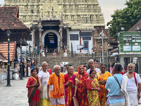 Hindu devotees are gathering outside the historic Sree Padmanabhaswamy Temple during the Panguni Utsavam (Painkuni Utsavam) festival in Thir...