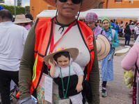 A pilgrim woman from the Sierra Gorda of Queretaro is posing for a photo while arriving at the Municipality of San Juan del Rio to continue...