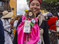 A pilgrim woman from the Sierra Gorda of Queretaro is posing for a photo while arriving at the Municipality of San Juan del Rio to continue...