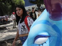 A woman is being seen during the inauguration of the 'Cowparade Mexico 2024' on Avenida Reforma in Mexico City, Mexico, on July 21, 2024. Co...