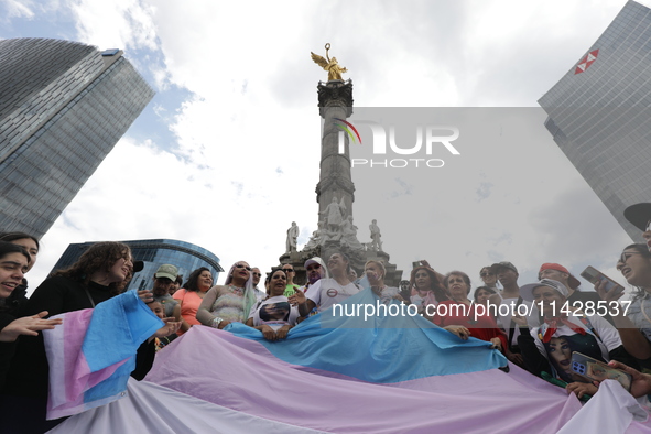 Activist Kenia Cuevas is leading a demonstration at the Angel de la Independencia for the ''Paola Buenrostro Law'', approved last Thursday b...