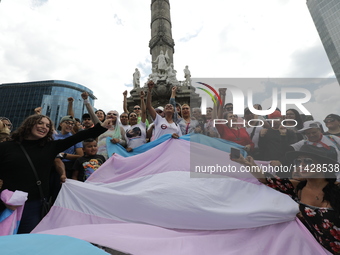 Activist Kenia Cuevas is leading a demonstration at the Angel de la Independencia for the ''Paola Buenrostro Law'', approved last Thursday b...