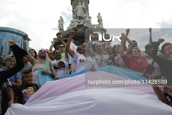 Activist Kenia Cuevas is leading a demonstration at the Angel de la Independencia for the ''Paola Buenrostro Law'', approved last Thursday b...