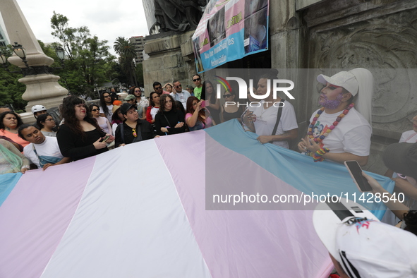 Activist Kenia Cuevas is leading a demonstration at the Angel de la Independencia for the ''Paola Buenrostro Law'', approved last Thursday b...