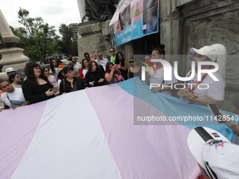 Activist Kenia Cuevas is leading a demonstration at the Angel de la Independencia for the ''Paola Buenrostro Law'', approved last Thursday b...