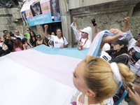 Activist Kenia Cuevas is leading a demonstration at the Angel de la Independencia for the ''Paola Buenrostro Law'', approved last Thursday b...