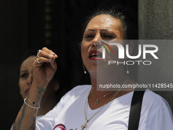 Activist Kenia Cuevas is speaking during a demonstration at the Angel de la Independencia for the ''Paola Buenrostro Law'', approved last Th...