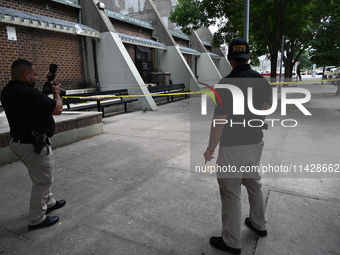 Crime scene investigators are placing evidence markers at the crime scene and are scouring the area for clues following an overnight fatal s...