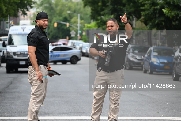 Crime scene investigators are placing evidence markers at the crime scene and are scouring the area for clues following an overnight fatal s...