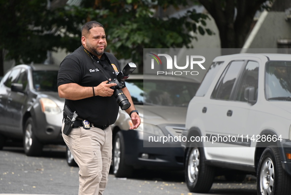 A crime scene investigator is scouring the area for clues following an overnight fatal shooting in Bronx, New York, United States, on July 2...