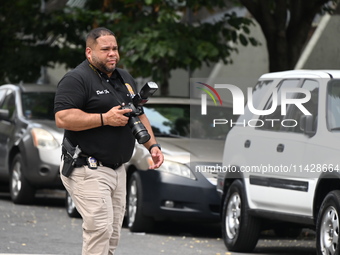 A crime scene investigator is scouring the area for clues following an overnight fatal shooting in Bronx, New York, United States, on July 2...