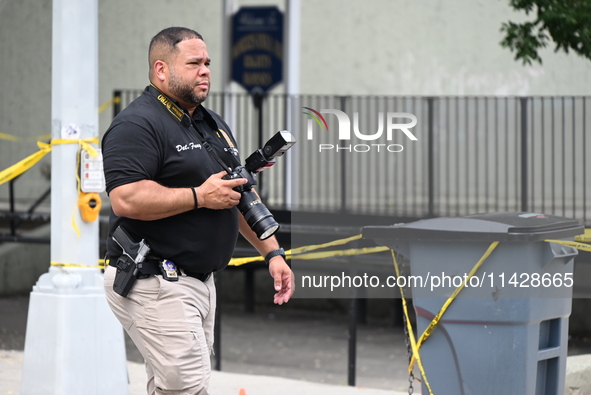 A crime scene investigator is scouring the area for clues following an overnight fatal shooting in Bronx, New York, United States, on July 2...