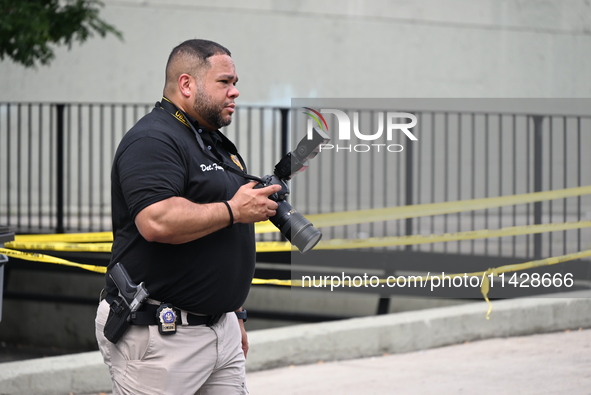 A crime scene investigator is scouring the area for clues following an overnight fatal shooting in Bronx, New York, United States, on July 2...