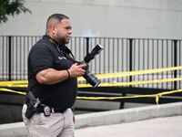 A crime scene investigator is scouring the area for clues following an overnight fatal shooting in Bronx, New York, United States, on July 2...