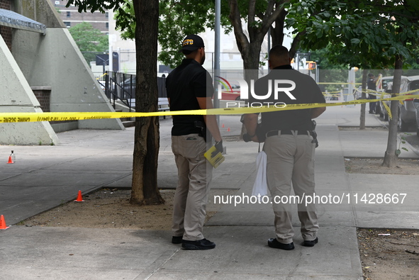 Crime scene investigators are placing evidence markers at the crime scene and are scouring the area for clues following an overnight fatal s...