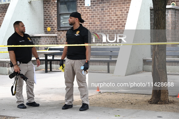 Crime scene investigators are placing evidence markers at the crime scene and are scouring the area for clues following an overnight fatal s...