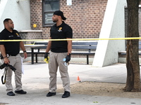 Crime scene investigators are placing evidence markers at the crime scene and are scouring the area for clues following an overnight fatal s...