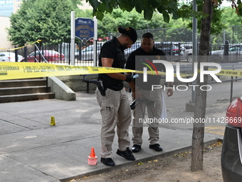 Crime scene investigators are placing evidence markers at the crime scene and are scouring the area for clues following an overnight fatal s...