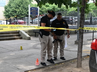 Crime scene investigators are placing evidence markers at the crime scene and are scouring the area for clues following an overnight fatal s...