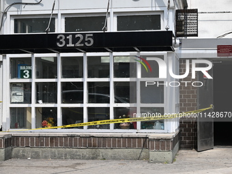 Police are taping off 41-year-old Raheem Blake's residence with crime scene tape following an overnight fatal shooting in Bronx, New York, U...