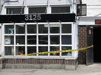 Police are taping off 41-year-old Raheem Blake's residence with crime scene tape following an overnight fatal shooting in Bronx, New York, U...