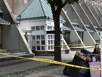 Police are taping off 41-year-old Raheem Blake's residence with crime scene tape following an overnight fatal shooting in Bronx, New York, U...