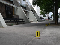 Evidence markers are being placed at the crime scene where shell casings are being discovered following an overnight fatal shooting in Bronx...