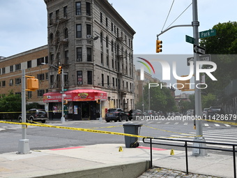 Evidence markers are being placed at the crime scene where shell casings are being discovered following an overnight fatal shooting in Bronx...