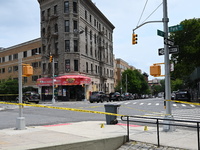 Evidence markers are being placed at the crime scene where shell casings are being discovered following an overnight fatal shooting in Bronx...