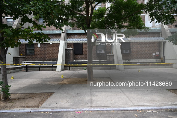 Evidence markers are being placed at the crime scene where shell casings are being discovered following an overnight fatal shooting in Bronx...