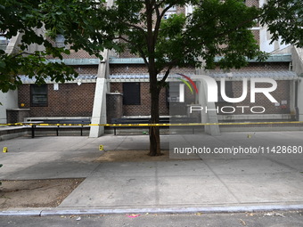 Evidence markers are being placed at the crime scene where shell casings are being discovered following an overnight fatal shooting in Bronx...