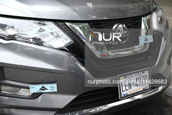 A Nissan Rogue is being tagged by crime scene investigators following an overnight fatal shooting in Bronx, New York, United States, on July...