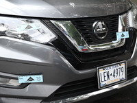 A Nissan Rogue is being tagged by crime scene investigators following an overnight fatal shooting in Bronx, New York, United States, on July...