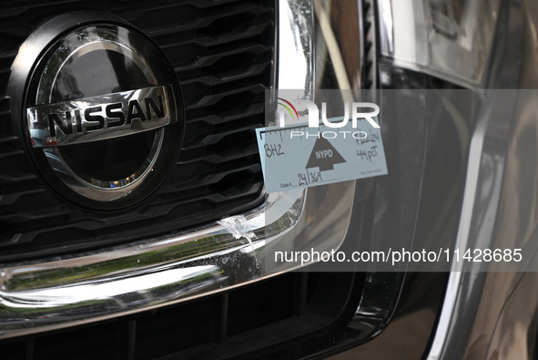 A Nissan Rogue is being tagged by crime scene investigators following an overnight fatal shooting in Bronx, New York, United States, on July...