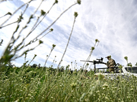 A fighter of the Separate Anti-Aircraft Machine Gun Battalion, who is providing air cover for the unmanned aerial vehicles and destroying ta...