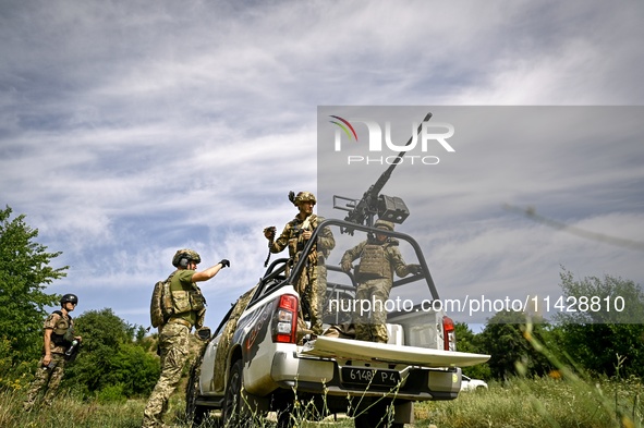 Fighters of the Separate Anti-Aircraft Machine Gun Battalion, who are providing air cover for unmanned aerial vehicles and destroying target...