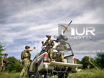 Fighters of the Separate Anti-Aircraft Machine Gun Battalion, who are providing air cover for unmanned aerial vehicles and destroying target...