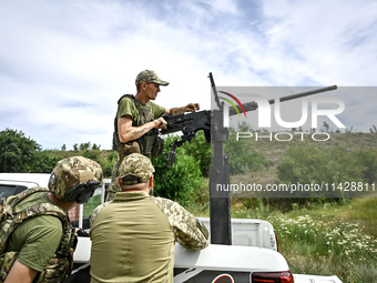 A fighter of the Separate Anti-Aircraft Machine Gun Battalion, who is providing air cover for the unmanned aerial vehicles and destroying ta...